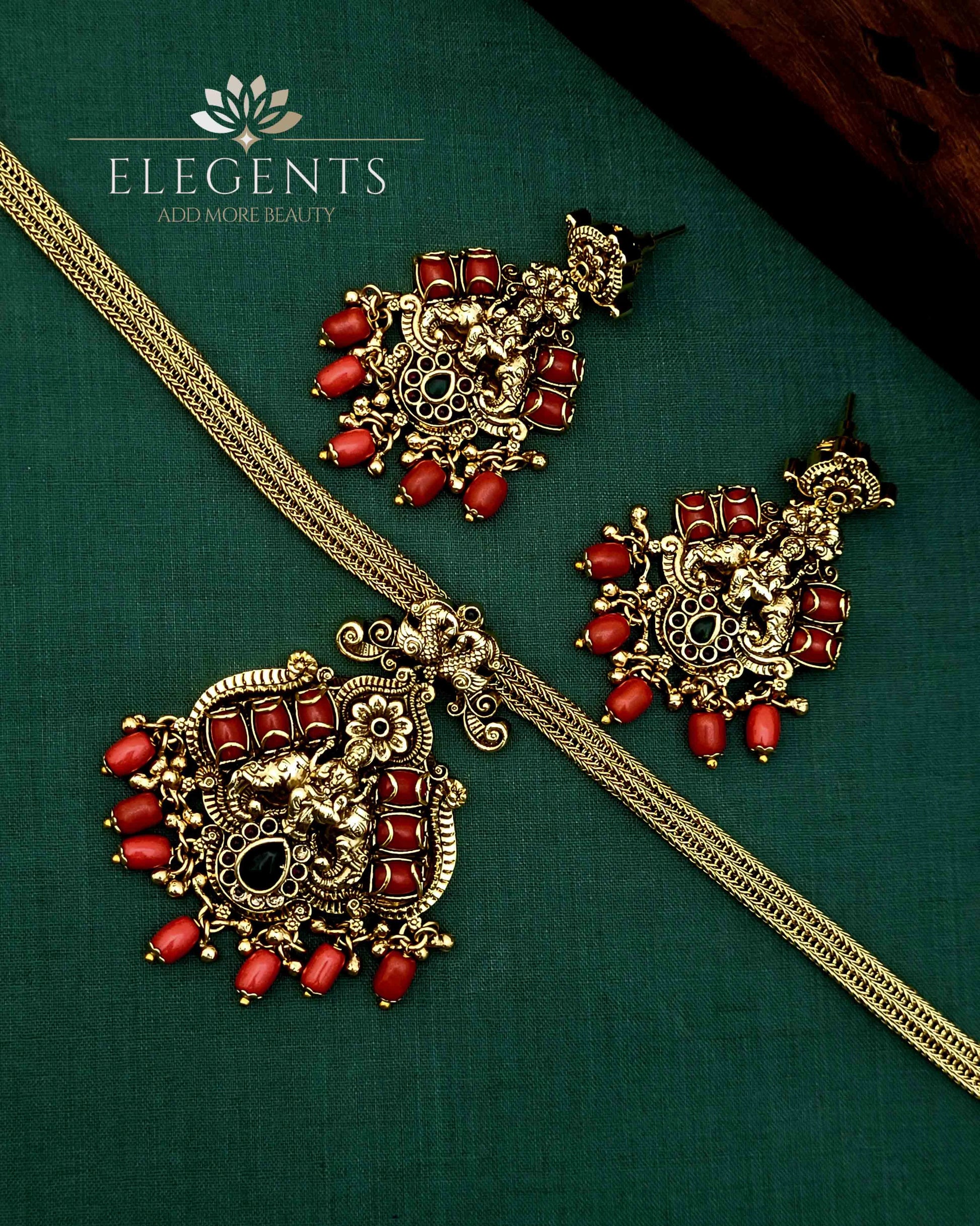Elegents' Coral Ghungroo Beads Lakshmi With Earrings.