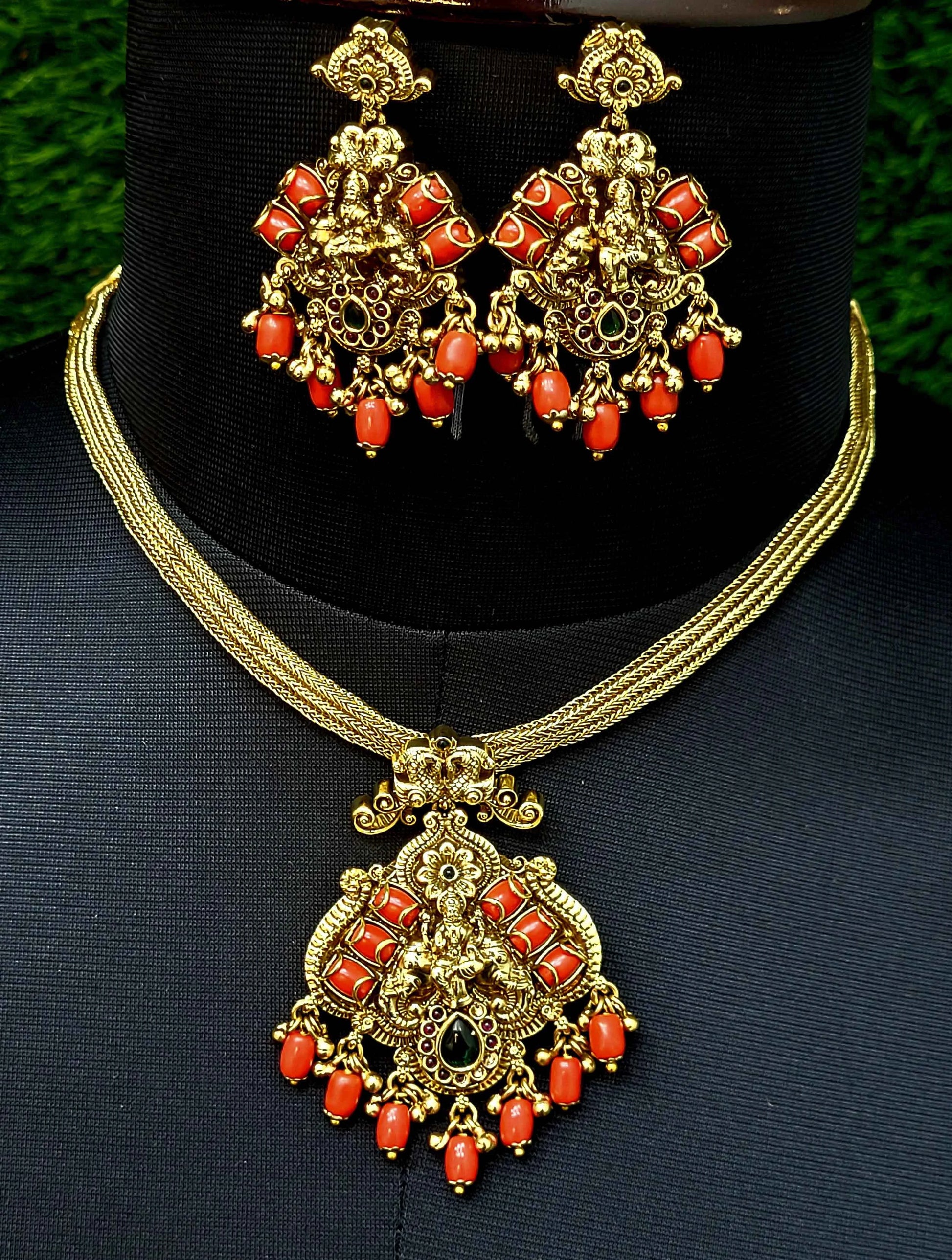 Elegents' Coral Ghungroo Beads Lakshmi With Earrings.