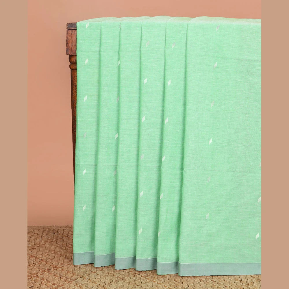 Pothys Pista green thread buttas Khadi cotton saree, contrast plain border, and pallu of geometric buttas