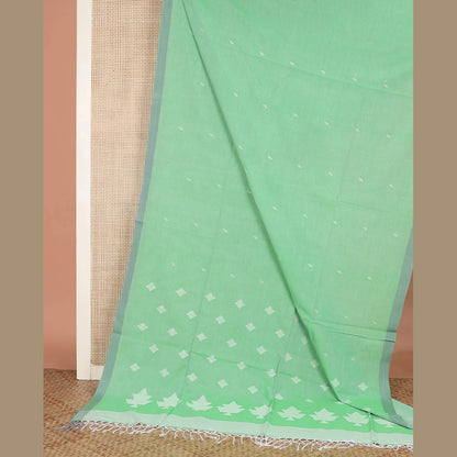 Pothys Pista green thread buttas Khadi cotton saree, contrast plain border, and pallu of geometric buttas
