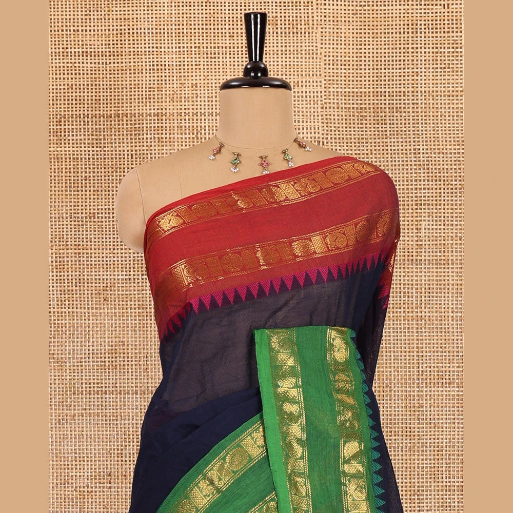 Pothys Navy Blue blue plain chettinad cotton saree , ganga jamuna rettai pettu border , lining pallu with tussels