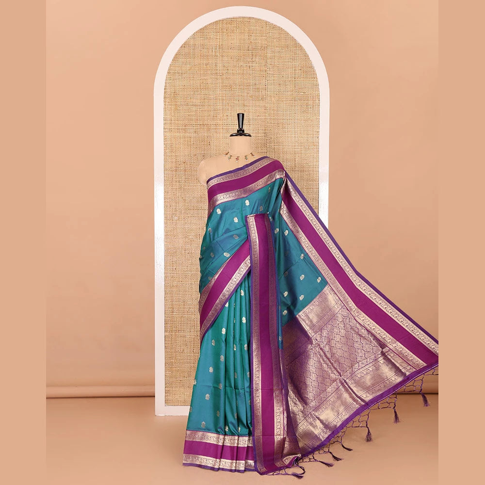 Pothys Blue zari buttas kanchi soft silk saree, contrast manga and peacock motifs woven rettai pettu border, ogee patterned pallu, and a zari design blouse