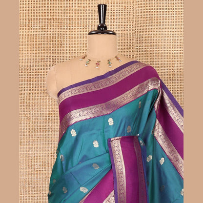Pothys Blue zari buttas kanchi soft silk saree, contrast manga and peacock motifs woven rettai pettu border, ogee patterned pallu, and a zari design blouse