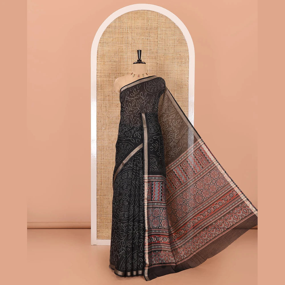 Pothys Black bandhani-style floral and chakra printed saree, zari piping border, contrast ajrakh printed pallu, and contrast ajrakh printed blouse