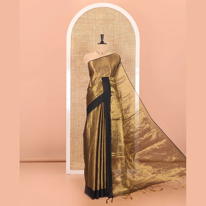 Pothys Gold plain khadi tissue saree with a self-pallu, and a matching blouse