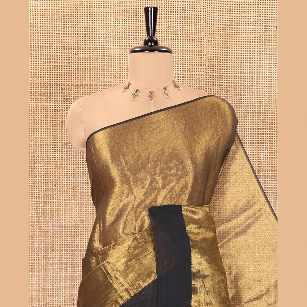 Pothys Gold plain khadi tissue saree with a self-pallu, and a matching blouse