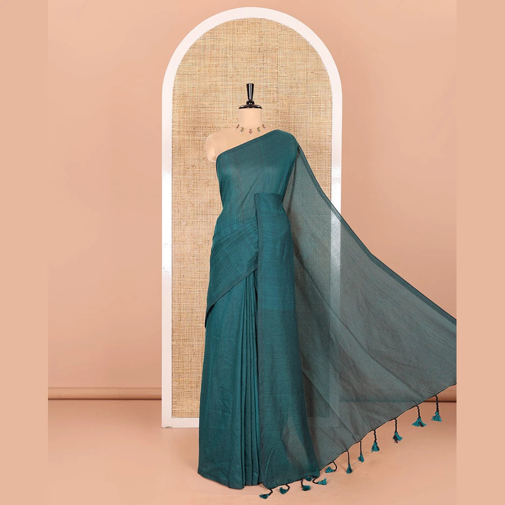 Pothys Borderless Peacock Color Plain Khadi Mul Cotton Saree Features a Self-Pallu with Tassels, and a Matching Blouse