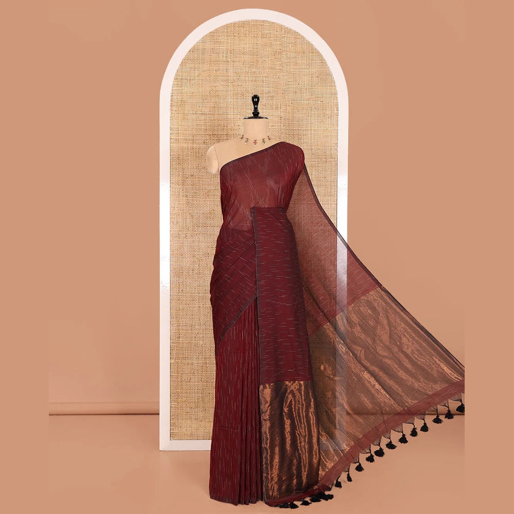 Pothys Borderless Maroon Khadi Mul Cotton Saree Decked with Jharna-Style Waterdrop Motifs, Featuring a Gleaming Zari-Woven Pallu, Paired with a Matching Blouse Replicating the Body Motifs