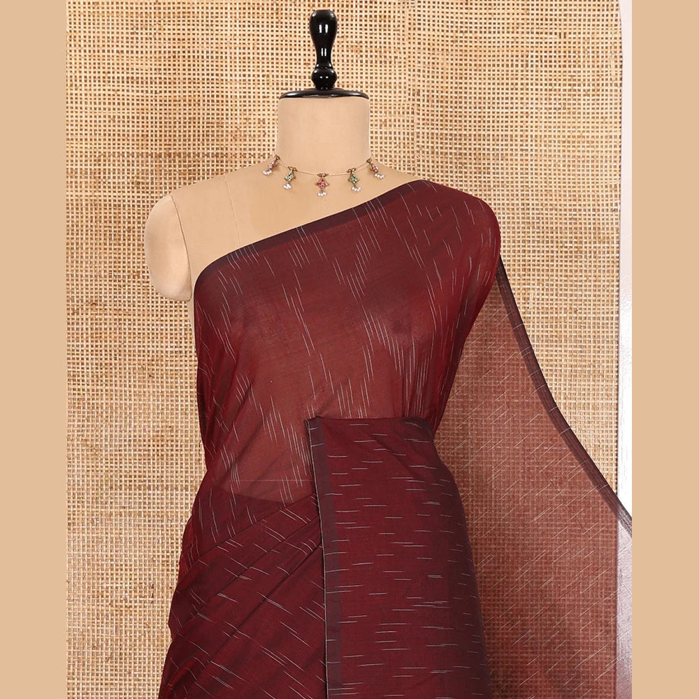 Pothys Borderless Maroon Khadi Mul Cotton Saree Decked with Jharna-Style Waterdrop Motifs, Featuring a Gleaming Zari-Woven Pallu, Paired with a Matching Blouse Replicating the Body Motifs