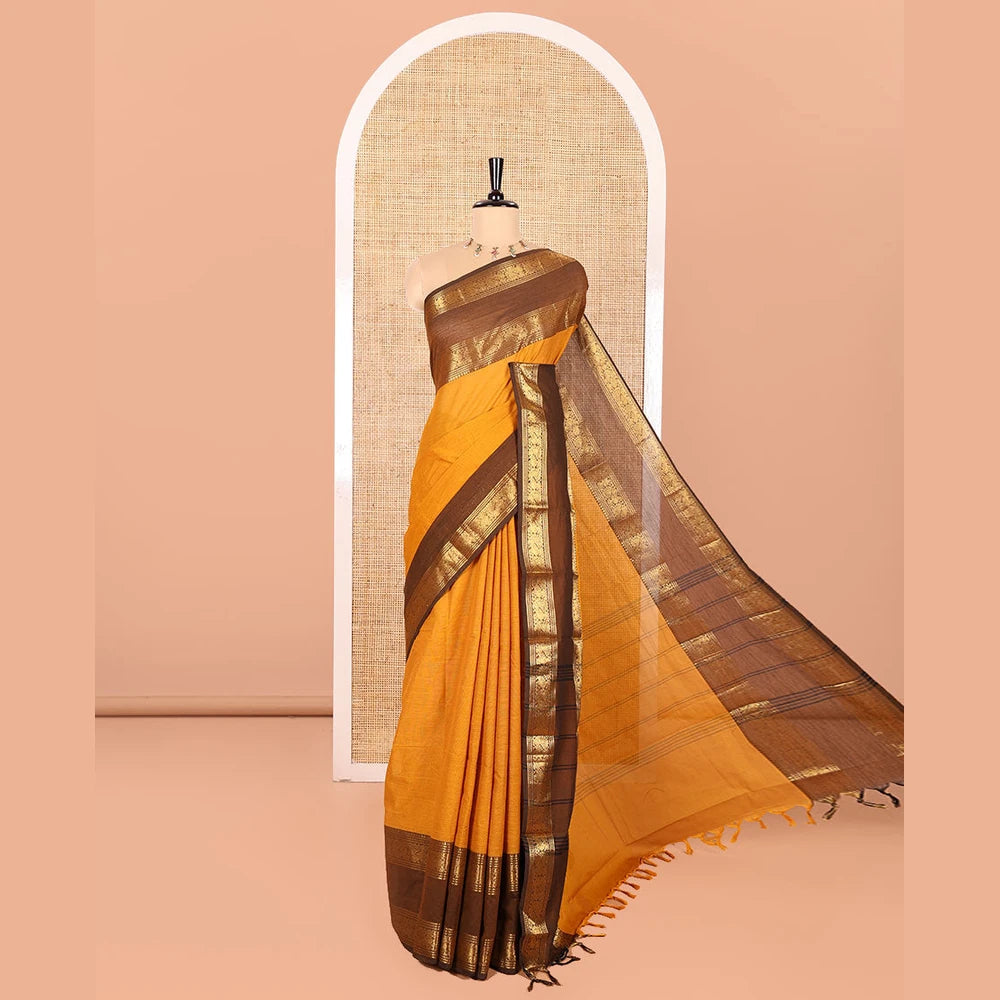 Pothys Mustard Plain Chettinad Cotton Saree, Complemented by Contrast Rettai Pettu Traditional Zari Temple Border of Peacocks, Subtly Striped Pallu, and Paired with a Matching Blouse