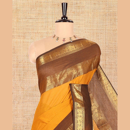Pothys Mustard Plain Chettinad Cotton Saree, Complemented by Contrast Rettai Pettu Traditional Zari Temple Border of Peacocks, Subtly Striped Pallu, and Paired with a Matching Blouse