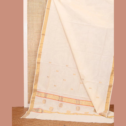 Pothys Cream Kerala Saree, Adorned with Zari Buttas on its Body, Subtly Sparkled Bavanji Border, Pallu Features Chakram Motifs, and Paired with a Matching Blouse
