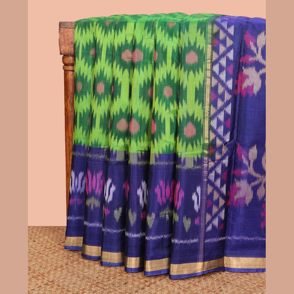 Pothys Green Ikkat Cotton Saree, Embellished with Ikkat-Style Buttas All Over Its Body, Complemented by a Contrast Border of Lotus Motifs in Ikkat-Style Weave, Pallu of Floral Designs in Ikkat Weave, and Paired with a Contrast Blouse