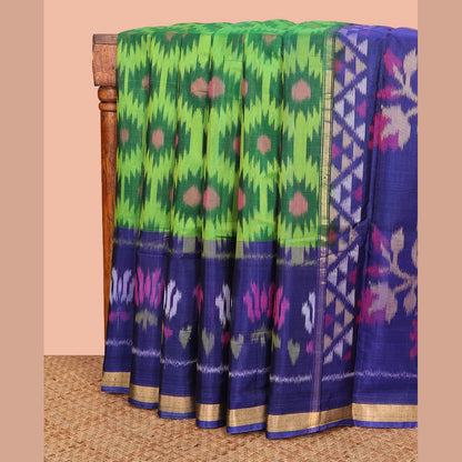 Pothys Green Ikkat Cotton Saree, Embellished with Ikkat-Style Buttas All Over Its Body, Complemented by a Contrast Border of Lotus Motifs in Ikkat-Style Weave, Pallu of Floral Designs in Ikkat Weave, and Paired with a Contrast Blouse