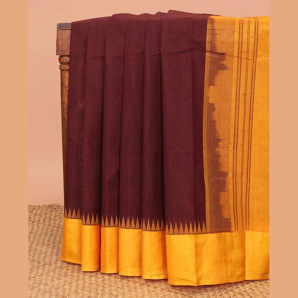 Pothys Brown Plain Kanchi Cotton Saree, Complemented by a Contrast Temple Border, Subtly Striped Pallu, and Paired with a Contrast Blouse