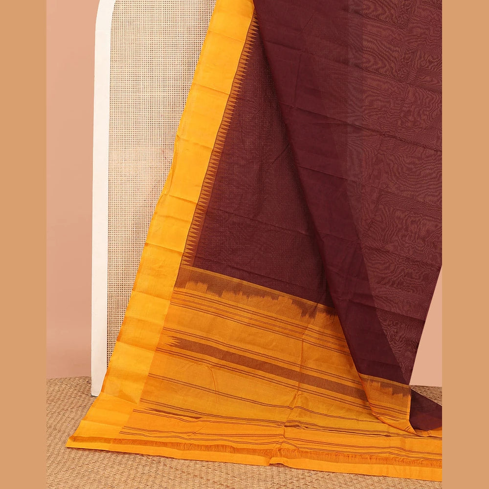 Pothys Brown Plain Kanchi Cotton Saree, Complemented by a Contrast Temple Border, Subtly Striped Pallu, and Paired with a Contrast Blouse
