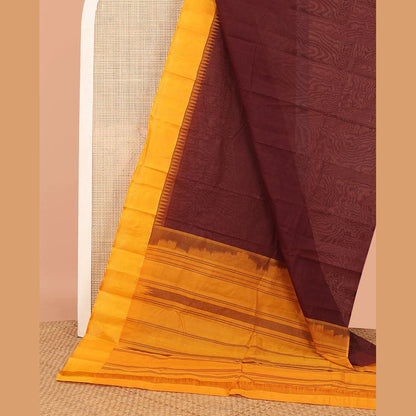 Pothys Brown Plain Kanchi Cotton Saree, Complemented by a Contrast Temple Border, Subtly Striped Pallu, and Paired with a Contrast Blouse