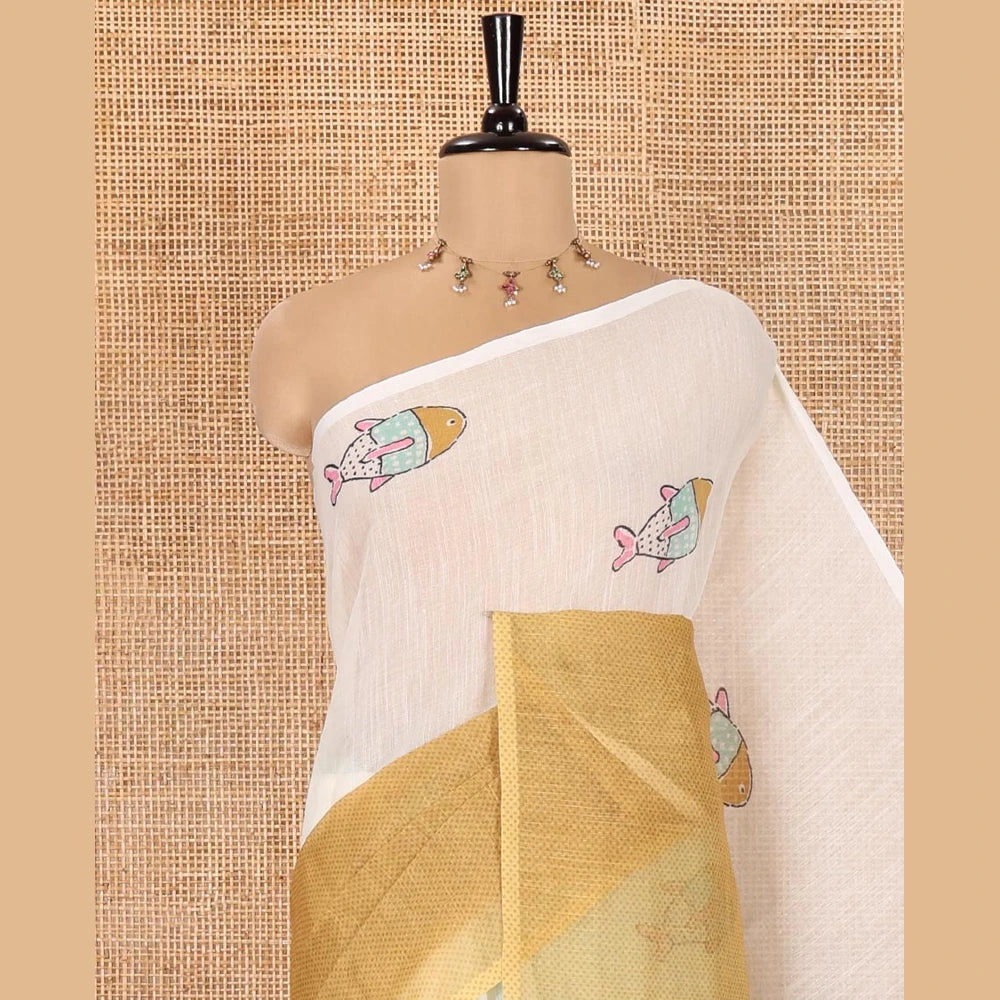 Pothys Borderless Cream and Mustard Linen Cotton Saree, Bedecked with Half-and-Half Style Fish Motifs Printed All Over Its Body, Pallu Mirrors the Same Print, and Is Paired with a Contrast Blouse