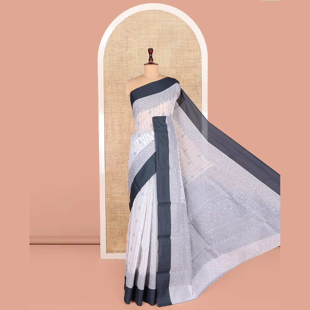 Pothys Grey Semi-Silk Cotton Saree, Sparsely Woven with Buttas and Geometric Designs All Over Its Body, Complemented by Contrast Border, Sparsely Woven Pallu of Geometric Designs, and Paired with a Matching Blouse