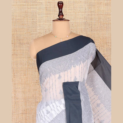 Pothys Grey Semi-Silk Cotton Saree, Sparsely Woven with Buttas and Geometric Designs All Over Its Body, Complemented by Contrast Border, Sparsely Woven Pallu of Geometric Designs, and Paired with a Matching Blouse