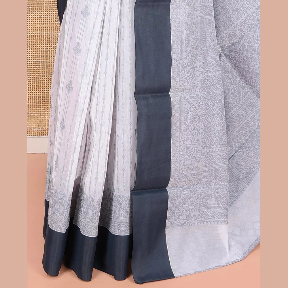 Pothys Grey Semi-Silk Cotton Saree, Sparsely Woven with Buttas and Geometric Designs All Over Its Body, Complemented by Contrast Border, Sparsely Woven Pallu of Geometric Designs, and Paired with a Matching Blouse