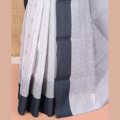 Pothys Grey Semi-Silk Cotton Saree, Sparsely Woven with Buttas and Geometric Designs All Over Its Body, Complemented by Contrast Border, Sparsely Woven Pallu of Geometric Designs, and Paired with a Matching Blouse