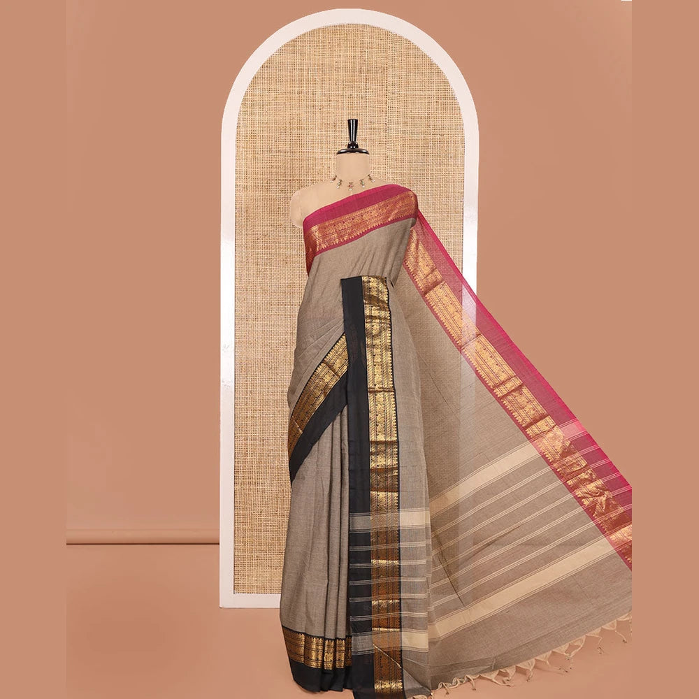 Pothys Light Brown Plain Chettinad Cotton Saree, Complemented by a Contrast Kal Erangina Traditional Zari Border of Peacock Designs, Subtly Striped Pallu, and Paired with a Matching Blouse