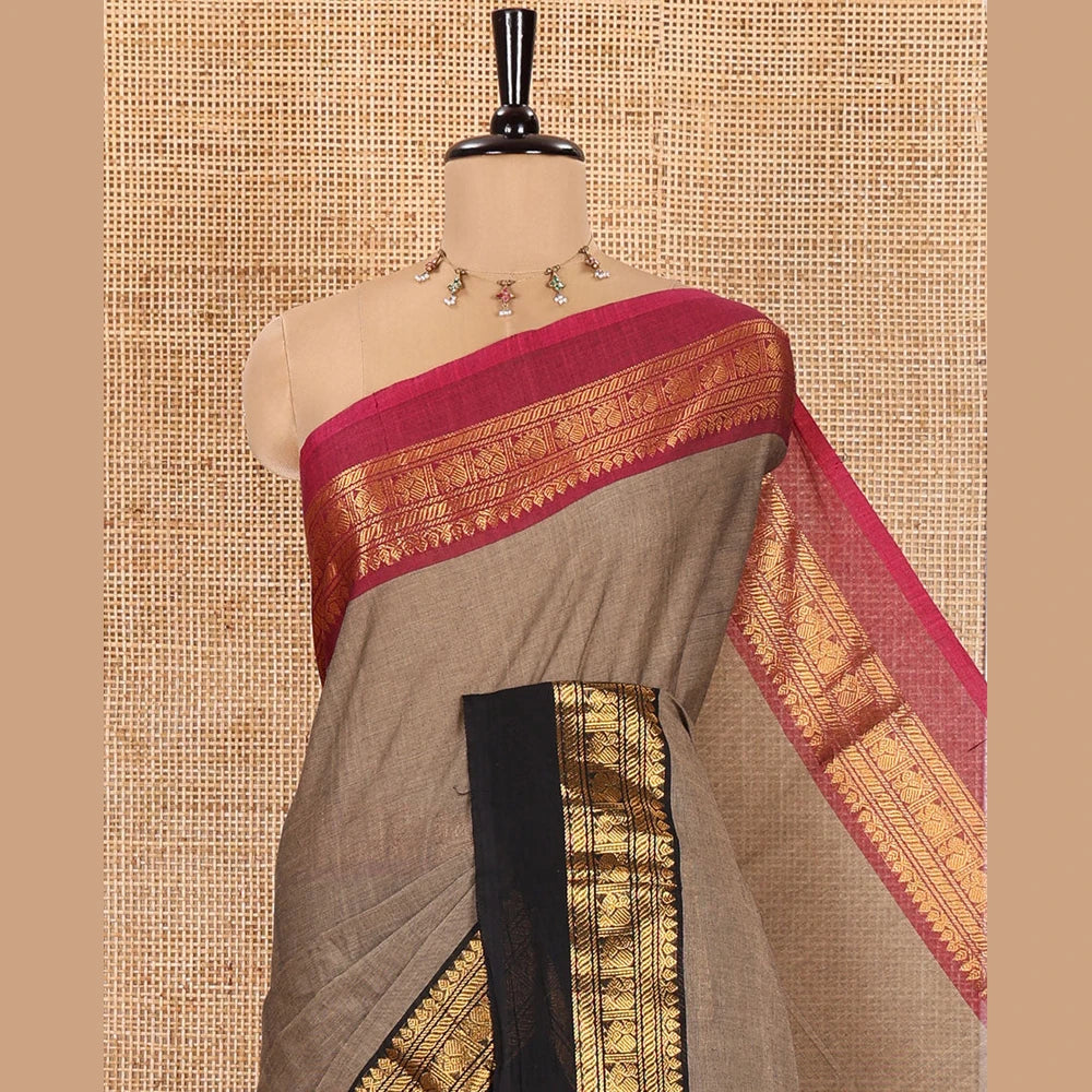 Pothys Light Brown Plain Chettinad Cotton Saree, Complemented by a Contrast Kal Erangina Traditional Zari Border of Peacock Designs, Subtly Striped Pallu, and Paired with a Matching Blouse