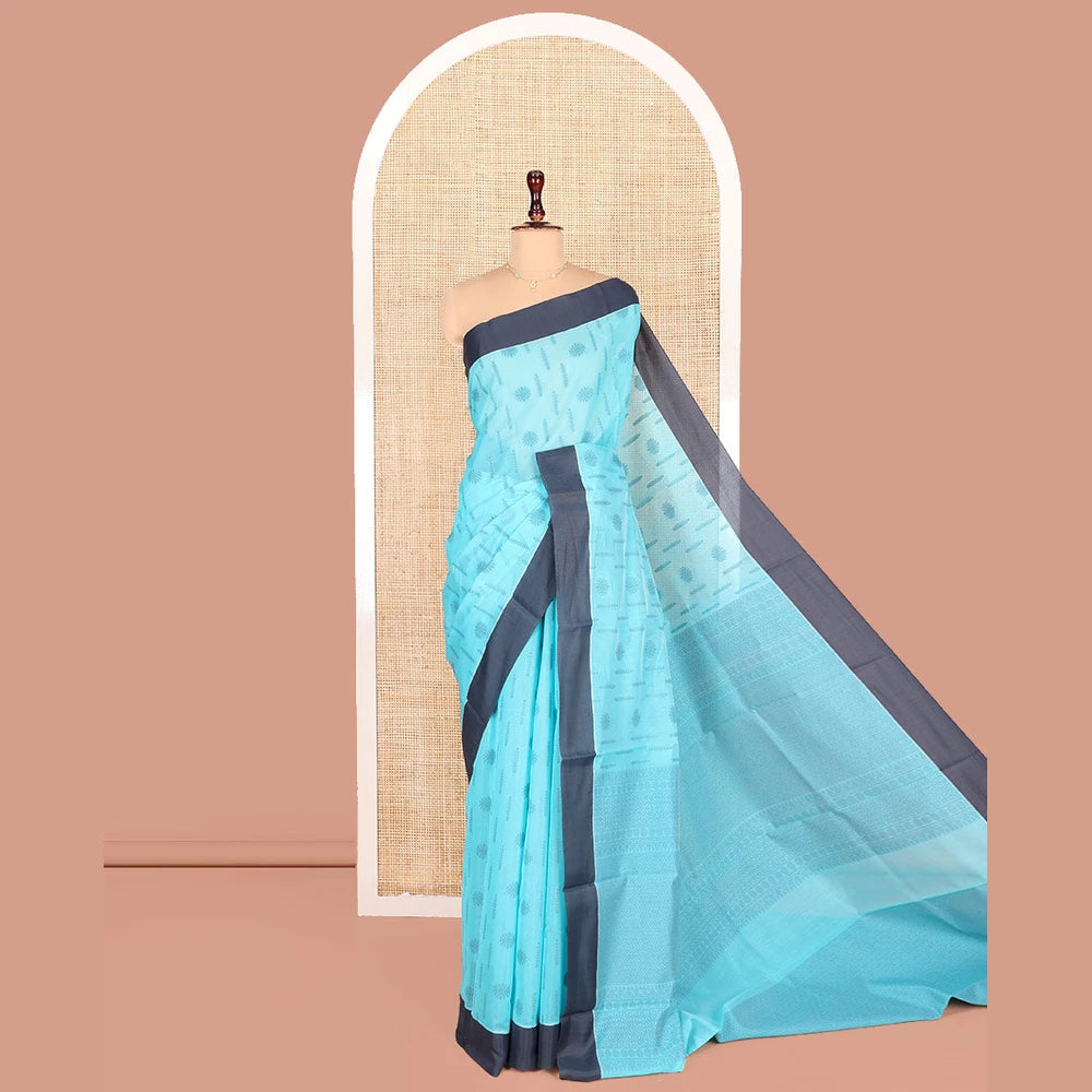 Pothys Blue Semi-Silk Cotton Saree, Subtly Adorned with Buttas on Its Body, Complemented by Contrast Border, Sparsely Designed Pallu of Geometric Designs, and Paired with a Matching Blouse