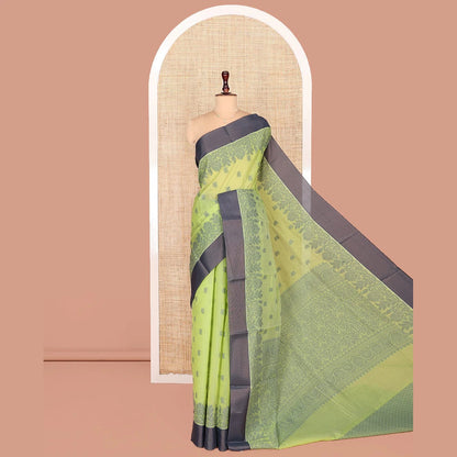 Pothys Green Semi-Silk Cotton Saree, Sparsely Woven with Floral Buttas on Its Body, Complemented by Contrast Border, Pallu Steeped with Floral Designs, and Paired with a Matching Blouse