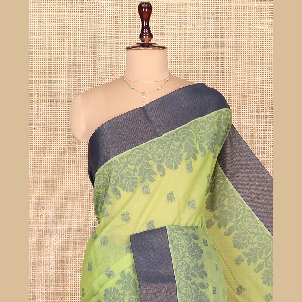 Pothys Green Semi-Silk Cotton Saree, Sparsely Woven with Floral Buttas on Its Body, Complemented by Contrast Border, Pallu Steeped with Floral Designs, and Paired with a Matching Blouse