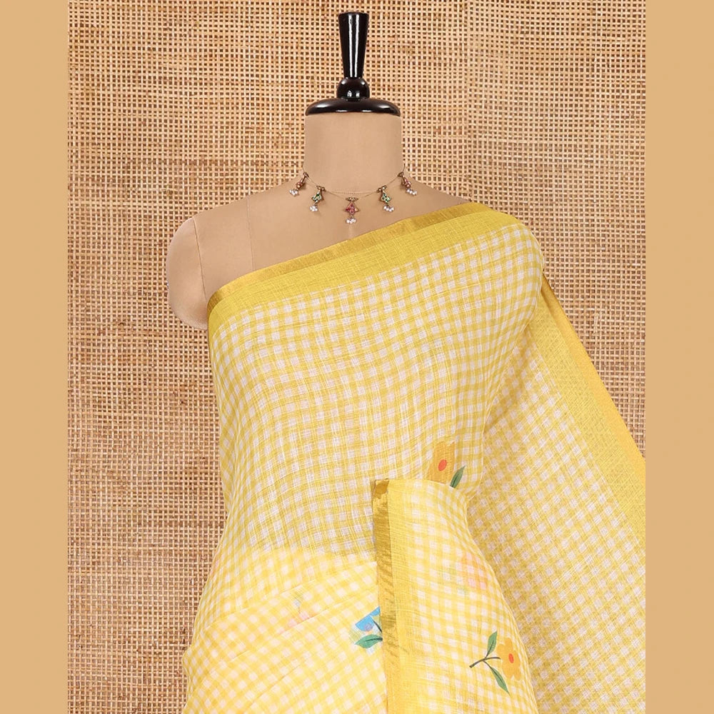 Pothys Yellow Linen Cotton Saree, Beautiful Decked Up with Checks and Floral Motifs Printed All Over Its Body, Subtle Piping Border, Pallu Mirrors the Same Design, and Paired with a Printed Blouse