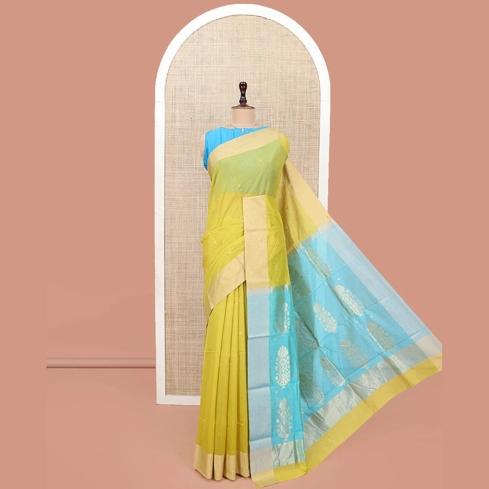 Pothys Yellow Chanderi Cotton Saree, Subtly Sparkled with Buttas All Over Its Body, Subtly Woven Bavanji Border, Complemented by a Contrast Pallu of Floral Designs, and Paired with a Contrast Blouse