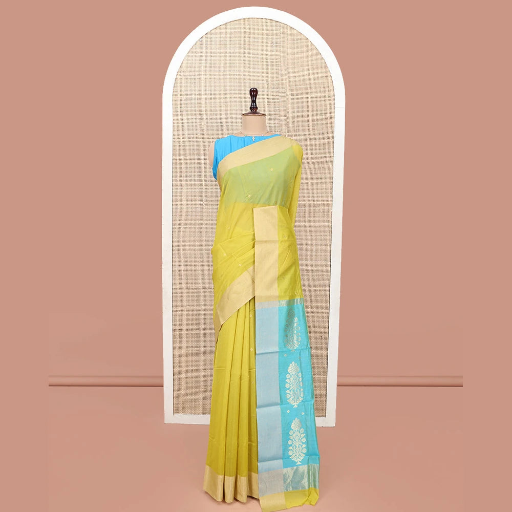 Pothys Yellow Chanderi Cotton Saree, Subtly Sparkled with Buttas All Over Its Body, Subtly Woven Bavanji Border, Complemented by a Contrast Pallu of Floral Designs, and Paired with a Contrast Blouse