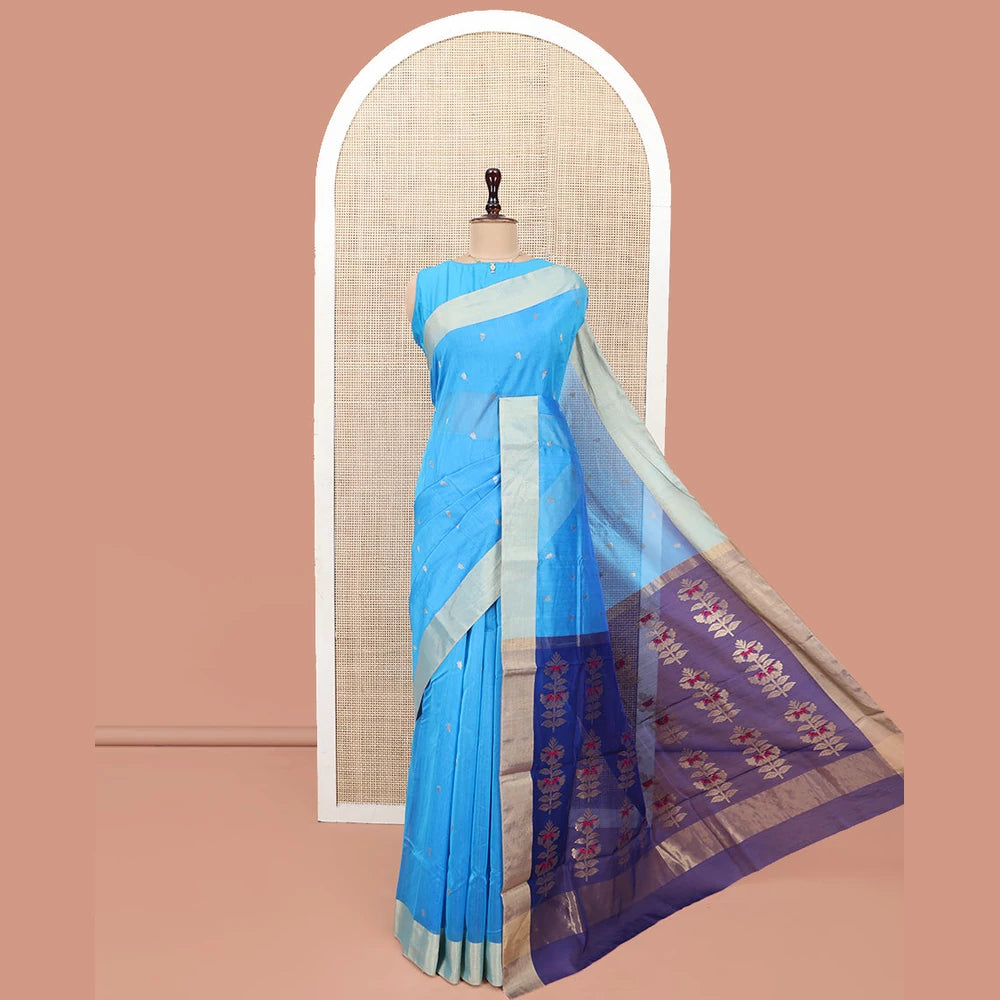 Pothys Blue Chanderi Cotton Saree, Subtly Sparkled with Buttas All Over Its Body, Subtly Woven Bavanji Border, Complemented by a Contrast Pallu Steeped with Floral Designs, and Paired with a Contrast Blouse
