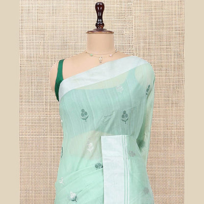 Pothys Green Chanderi Cotton Saree, Subtly Decked up with Floral Buttas All Over Its Body, Highlighted by a Bavanji Border, Pallu Steeped with Zari Stripes, and Paired with a Matching Blouse