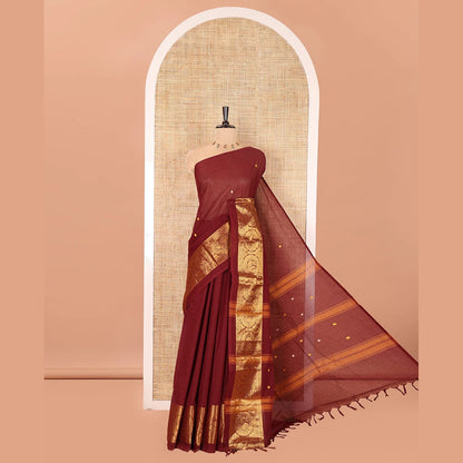 Pothys Coffee Brown Chettinad Cotton Saree, Subtly Sparkled with Buttas All Over Its Body, Highlighted Contrast by Zari Traditional Border of Round Chakram Designs, Pallu of Stripes and Buttas, and Paired with a Matching Blouse