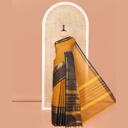 Pothys Mustard Plain Chettinad Cotton Saree, Complemented by a Contrast Zari Traditional Border Steeped with Peacock Designs, Subtly Striped Pallu, and Paired with a Matching Blouse