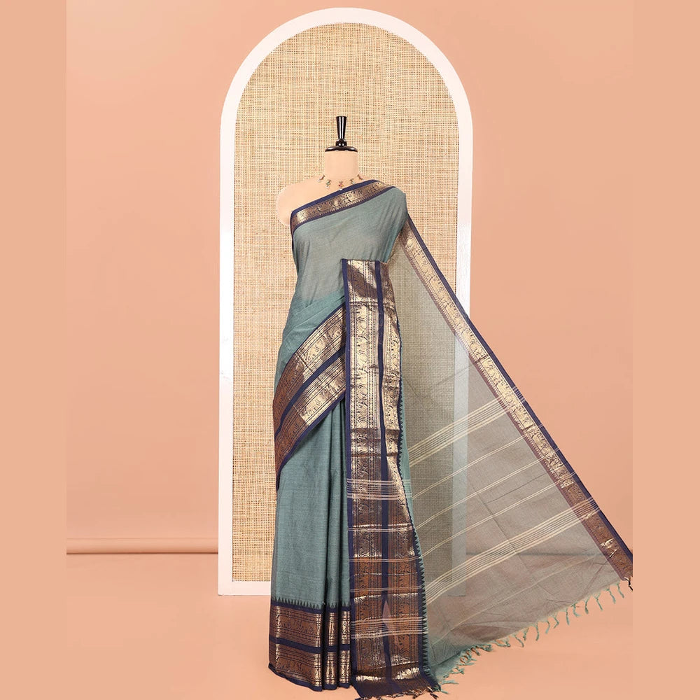Pothys Green Plain Chettinad Cotton Saree, Complemented by a Contrast Traditional Zari Border of Peacock and Elephant Designs, Subtly Striped Pallu, and Paired with a Matching Blouse