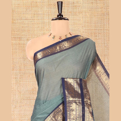 Pothys Green Plain Chettinad Cotton Saree, Complemented by a Contrast Traditional Zari Border of Peacock and Elephant Designs, Subtly Striped Pallu, and Paired with a Matching Blouse