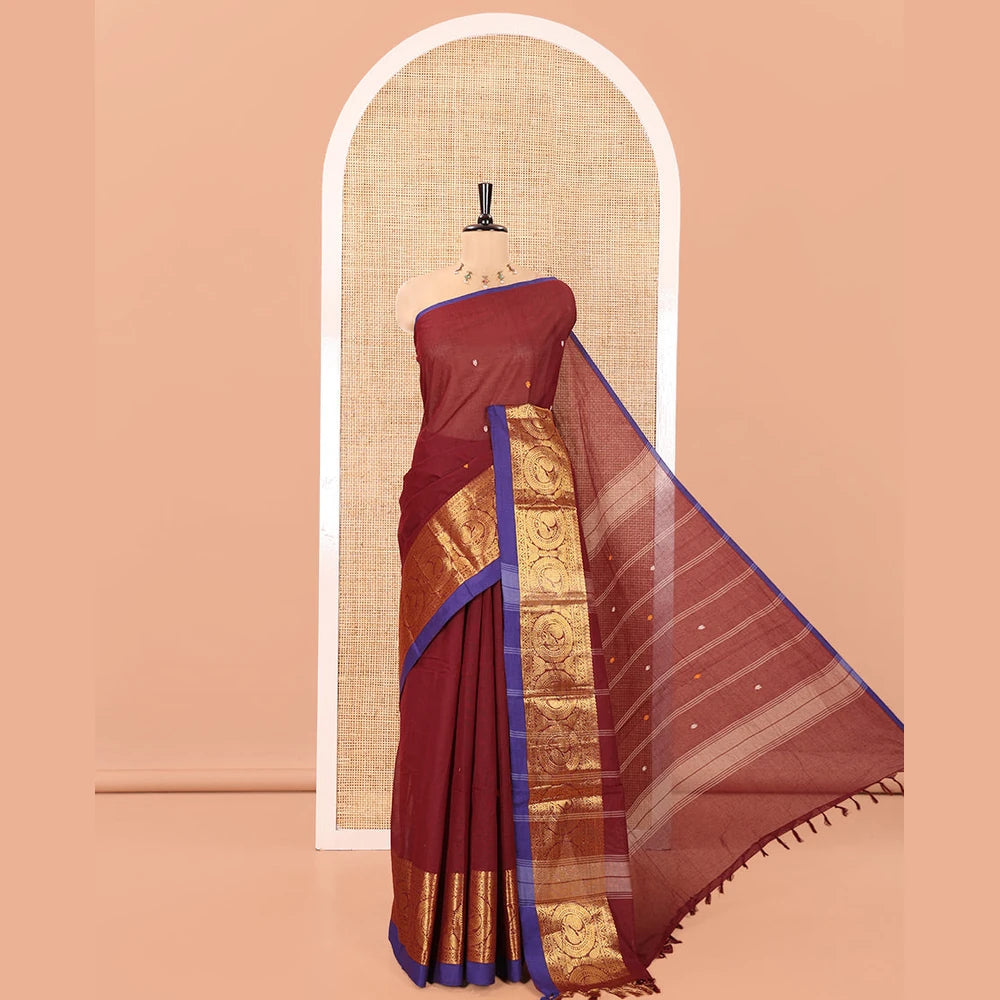 Pothys Maroon Chettinad Cotton Saree, Elevated with Thread Buttas All Over Its Body, Highlighted by Traditional Zari Border of Round Peacock Designs, Subtly Striped Pallu, and Paired with a Matching Blouse