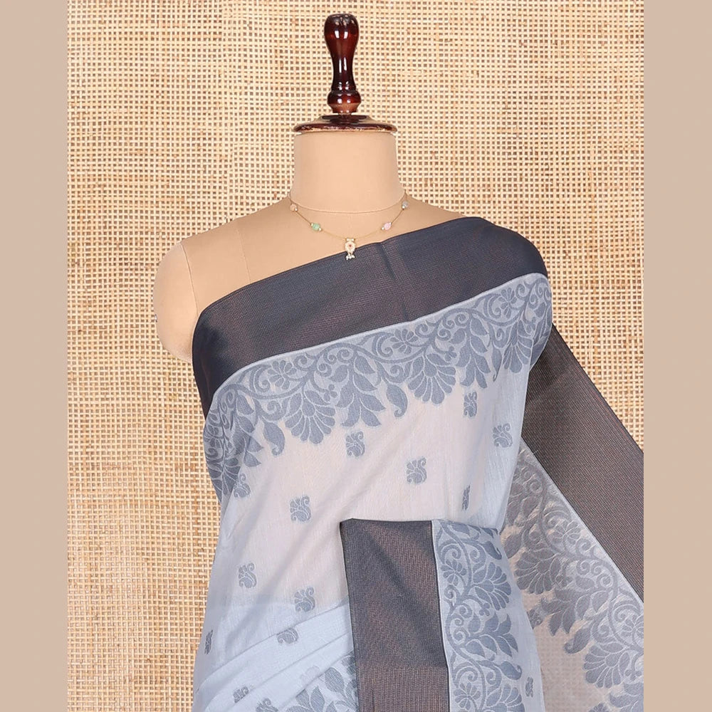 Pothys Grey Semi-Silk Cotton Saree, Detailed with Buttas All Over Its Body, Complemented by a Contrast Border, Pallu Steeped with Floral Designs, and Paired with a Matching Blouse