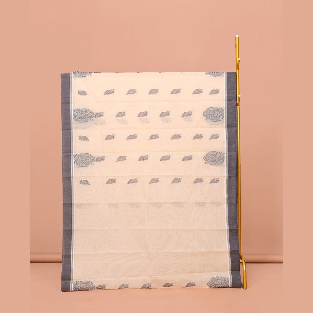 Pothys Cream Kanchi Cotton Saree, Embellished with Leaf Buttas All Over Its Body, Complemented by Contrast Border, Pallu of Intricate Designs, and Paired with a Matching Blouse
