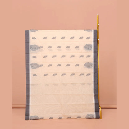 Pothys Cream Kanchi Cotton Saree, Embellished with Leaf Buttas All Over Its Body, Complemented by Contrast Border, Pallu of Intricate Designs, and Paired with a Matching Blouse