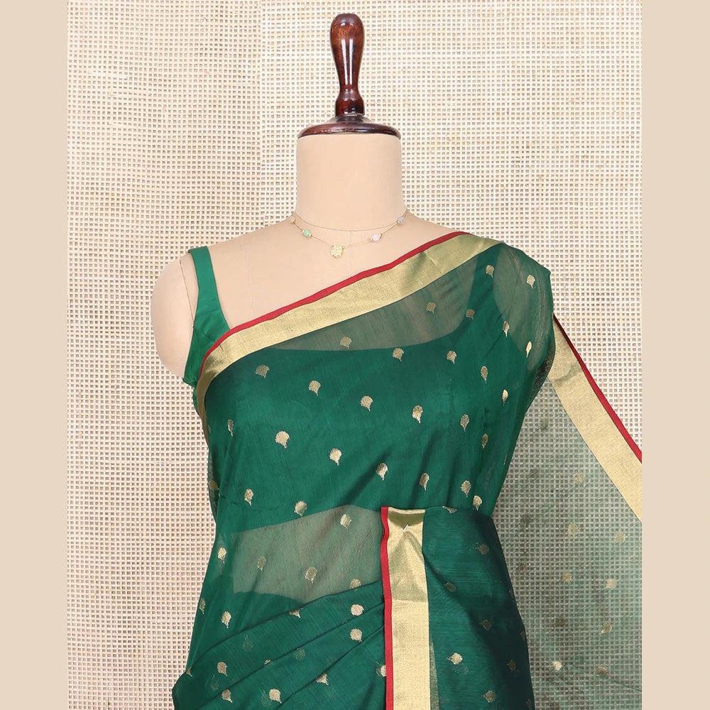 Pothys Green Chanderi Cotton Saree, Spotlighted with Zari Buttas All Over Its Body, Highlighted by Zari Border, Pallu of Floral Buttas, and Paired with a Contrast Blouse