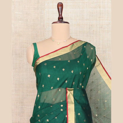 Pothys Green Chanderi Cotton Saree, Spotlighted with Zari Buttas All Over Its Body, Highlighted by Zari Border, Pallu of Floral Buttas, and Paired with a Contrast Blouse