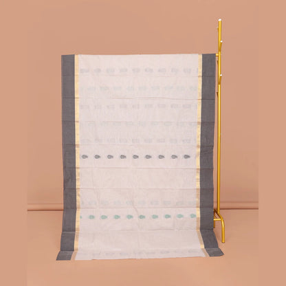 Pothys Off-White Kanchi Cotton Saree, Decked Up with Buttas All Over Its Body, Complemented by a Contrast Border, Pallu of Paisley Designs, and Paired with a Matching Blouse