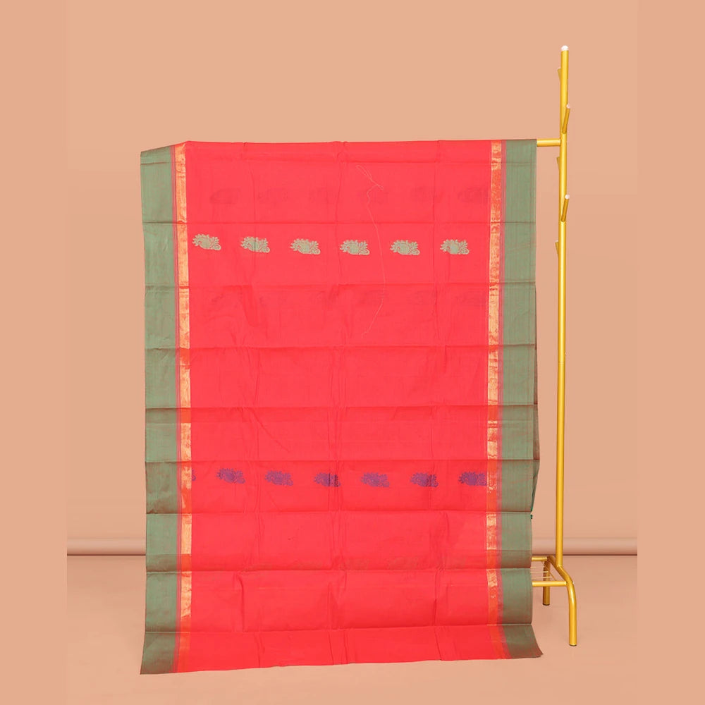 Pothys Red Kanchi Cotton Saree, Subtly Threaded with Floral Buttas All Over Its Body, Complemented by Contrast Zari Border, Pallu of Floral Designs, and Paired with a Matching Blouse
