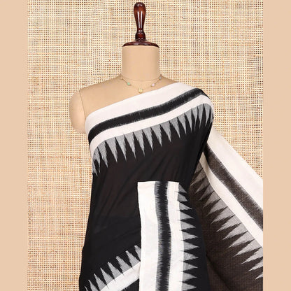 Pothys Black Plain Ikkat Cotton Saree, Complemented by a Contrast Ikkat Temple Border, Pallu Steeped with Buttas, and Paired with a Contrast Blouse