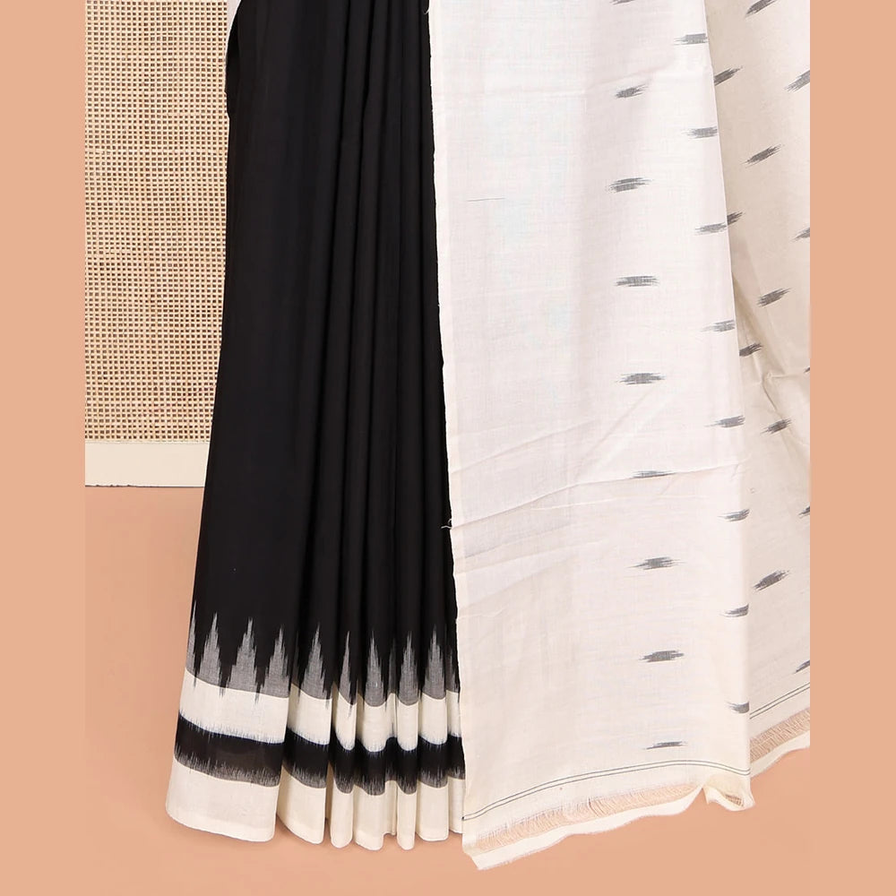Pothys Black Plain Ikkat Cotton Saree, Complemented by a Contrast Ikkat Temple Border, Pallu Steeped with Buttas, and Paired with a Contrast Blouse